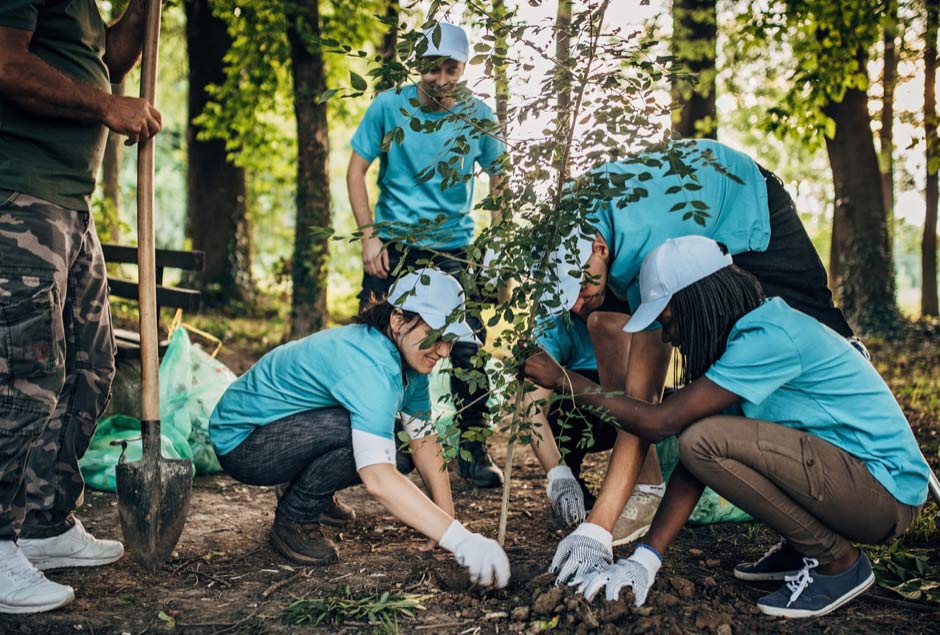 group of kids planting flowers